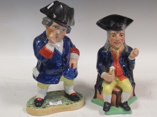Lot 216 - Two traditional Toby jugs, one with hat lid...