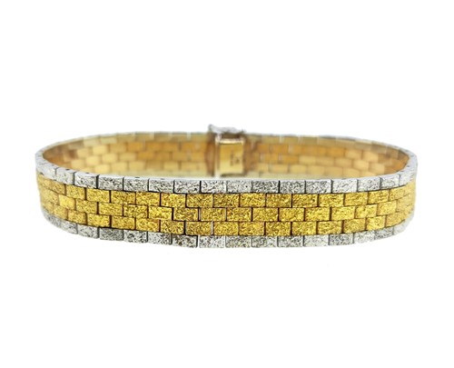 Lot 83 - A late 20th century two colour gold brick link bracelet