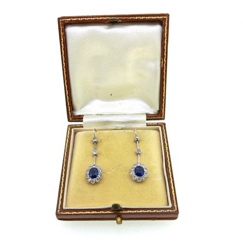 Lot 179 - A pair of early 20th century sapphire and diamond cluster ear pendants