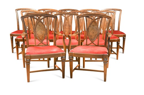Lot 585 - A set of fourteen walnut dining chairs including two armchairs, circa 1910