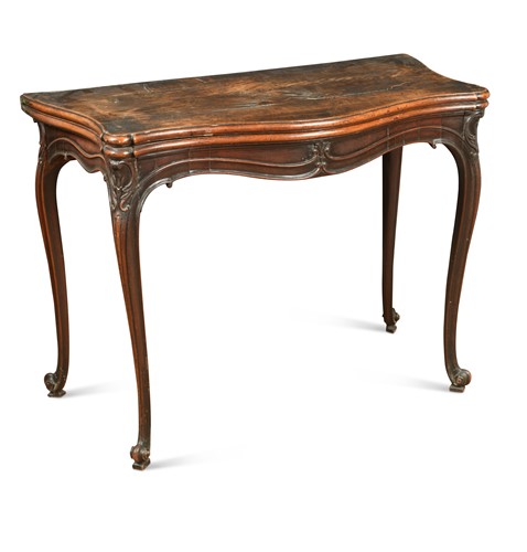 Lot 486 - A George III mahogany serpentine fronted fold over card table