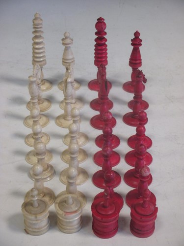 Lot 140 - An Indian ivory and red stained chess set...