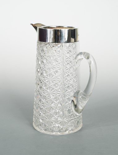 Lot 435 - An Edward VII cut glass lemonade jug with silver collar and spout