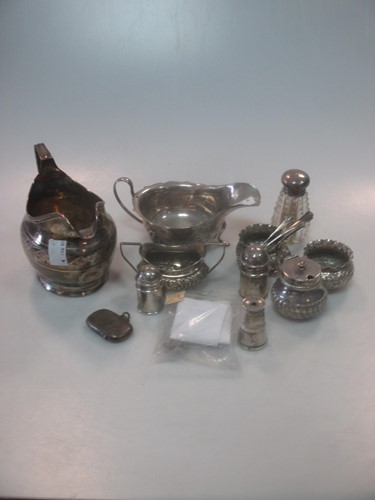 Lot 409 - A collection of silverware including cream jug,...