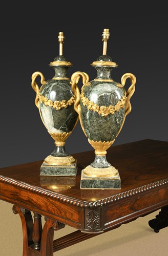 Lot 517 - A pair of ormolu mounted marble baluster table lamps, 20th century