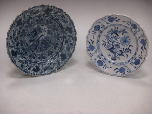 Lot 6 - A Delft plate decorated with a peacock...