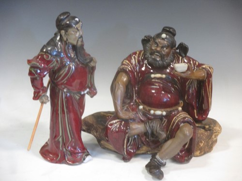 Lot 40 - A large Chinese Shiwan glazed pottery figure...