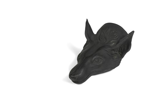 Lot 429 - A black basalt stirrup cup, modelled as a fox's head