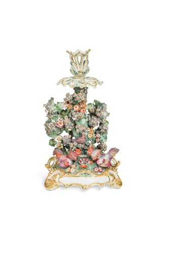 Lot 415 - A Chelsea bocage candlestick, circa 1760