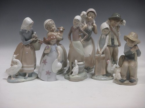 Lot 55 - 8 Lladro and Nao Spanish porcelain figures and...