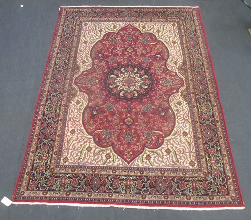 Lot 604 - A Heriz type carpet with central medallion 337...