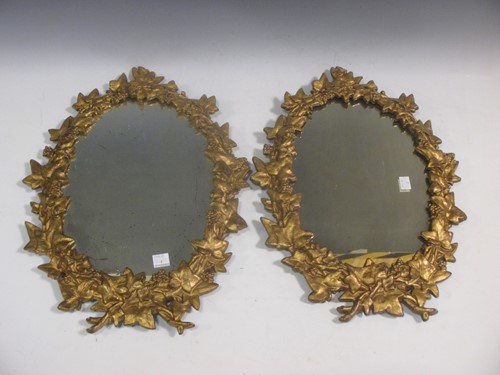 Lot 584 - A pair of 19th century cast iron ivy framed...
