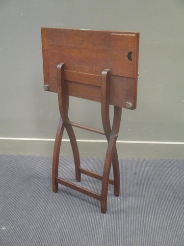 Lot 581 - An Edwardian oak folding games table on "X"...