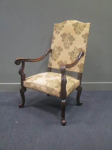 Lot 570 - A French early 19th century carved walnut...