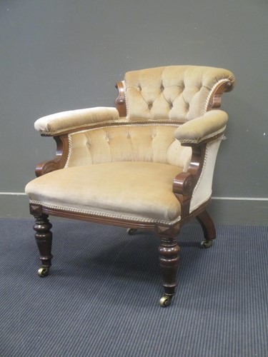 Lot 572 - An early Victorian walnut button back armchair...