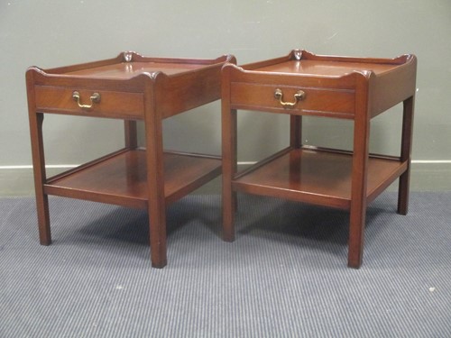 Lot 574 - A pair of Georgian style two tier lamp tables,...
