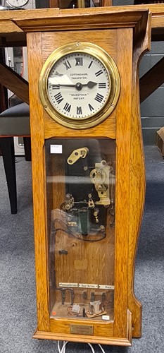 Lot 248 - Pale oak case electric wall clock by Silent...