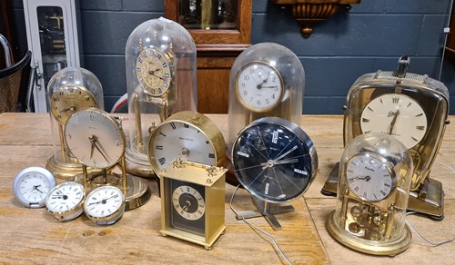 Lot 250 - Five anniversary clocks and five battery...