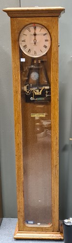 Lot 267 - Gillett and Johnston electric master clock, in...