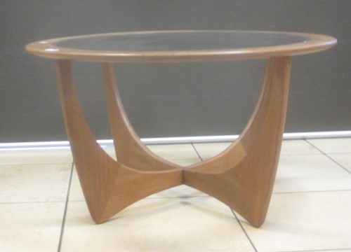 Lot 704 - A circular 1960s teak coffee table with...