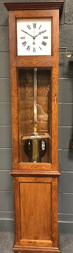 Lot 279 - Magneta of London electric master oak longcase...