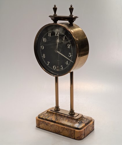 Lot 319 - A British made gravity clock with 10cm dial,...