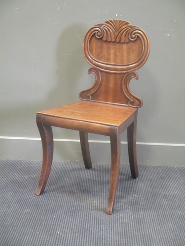 Lot 609 - A 19th century mahogany hall chair with...