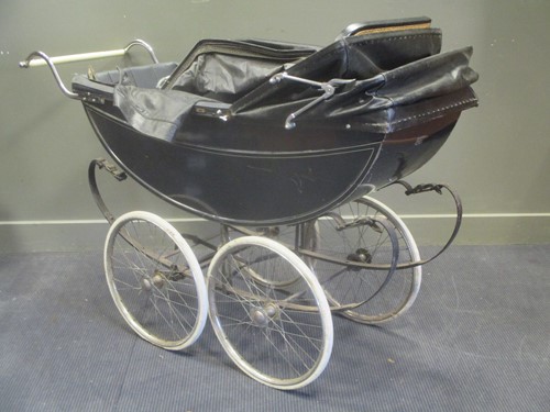 Lot 620 - A 20th century coach build pram, together with...