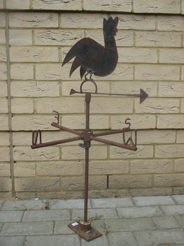 Lot 188 - A cast metal weathervane surmounted by a...
