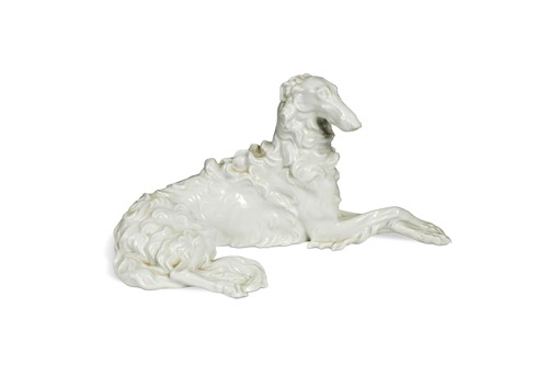 Lot 83 - A Vienna porcelain blanc de chine model of a reclining Borzoi