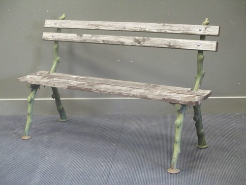 Lot 714 - A cast iron and timber slatted garden bench