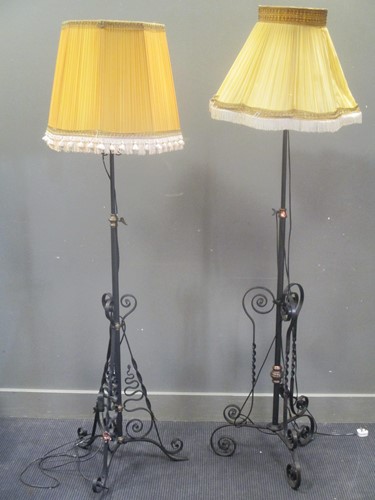Lot 614 - Two similar wrought iron and copper standard...
