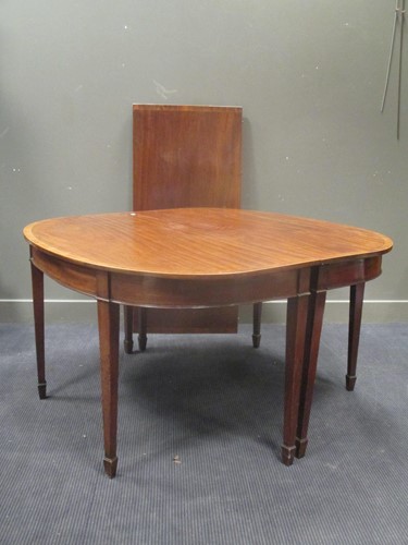 Lot 556 - A George III mahogany D-end dining table with...