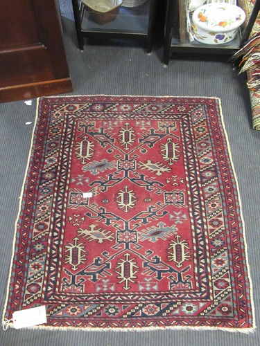 Lot 593 - Three small red ground rugs. 118 x 96 cm (3)