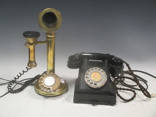Lot 123 - A vintage bakelite telephone together with a...