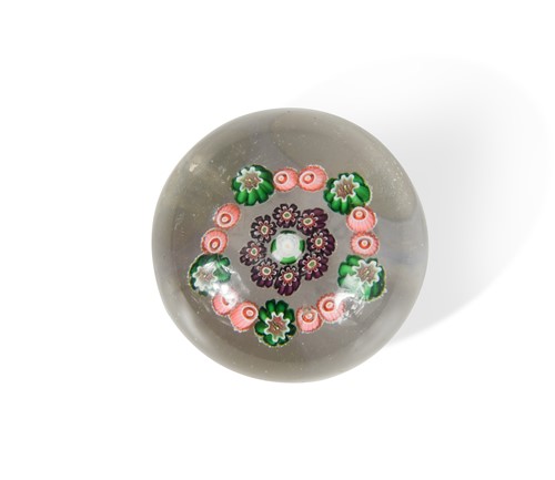 Lot 57 - A small Clichy millefiori cluster and wreath glass paperweight