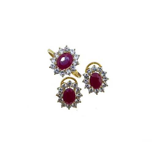 Lot 236 - A ruby and cubic zirconia ring with ear studs...