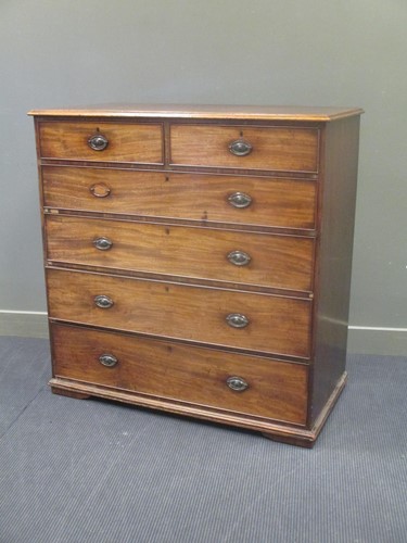 Lot 637 - A large George III mahogany chest of two short...