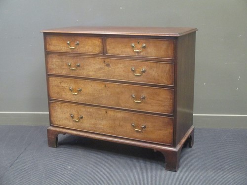 Lot 555 - A George III mahogany chest of two short over...