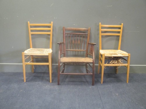 Lot 604 - A pair of 20th century teak and rush seated...