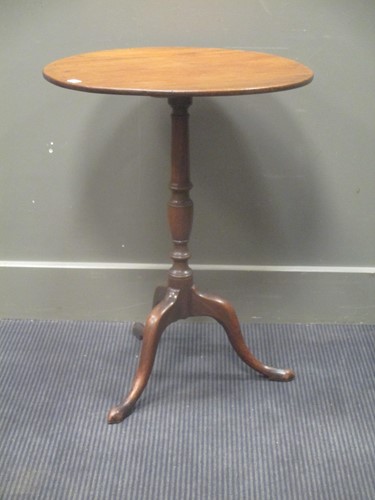 Lot 553 - A George III mahogany tilt top tripod table,...