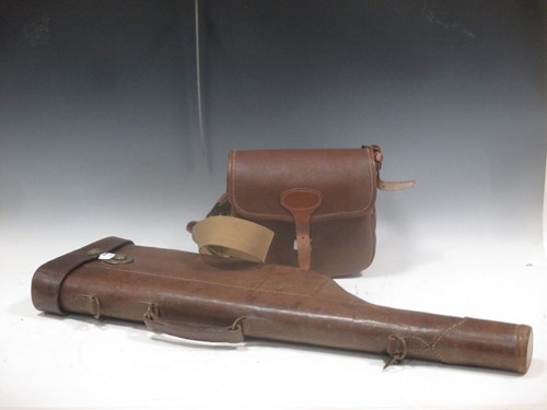 Lot 121 - A leather gun case, three globe trotter...