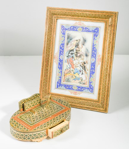 Lot 79 - An Islamic goauche courtship scene in an elaborate inlaid frame and matching inlaid inkstand