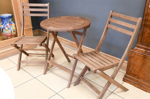 Lot 713 - A modern hardwood folding garden table and 2 matching chairs