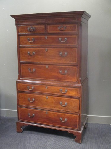 Lot 534 - A 19th century inlaid mahogany chest on chest,...