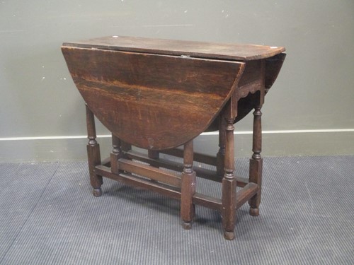 Lot 652 - An 18th or early 19th century oak side table...