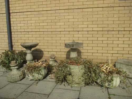 Lot 718 - A collection of stone garden planters,...