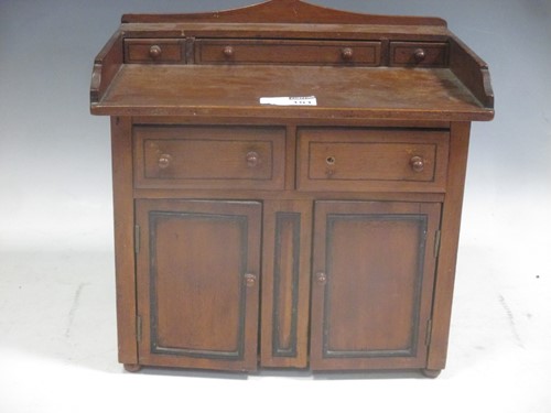 Lot 101 - An apprentice cabinet with drawers and...