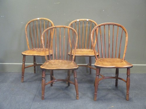 Lot 694 - Four matched early 19th century stick back...