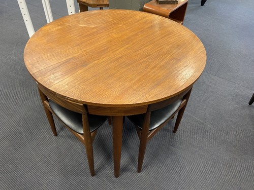 Lot 259 - Hans Olsen for Frem Rojle, a Danish teak dining table and four hideaway chairs, circa 1965